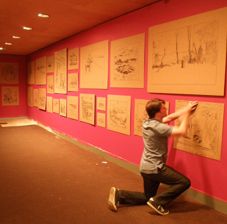 Andrew Davis with his cardboard recreations. [Photo via the Clark Art blog]